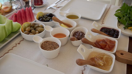 Concept promotional morning breakfast in the hotel, tasty Egg Benedict,Turkish and French Breakfast, tea and orange juice. near swimming pool	