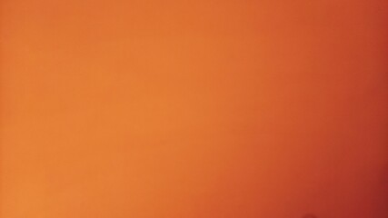 The paper is orange with a transition from yellow to dark orange. Light tone on the left, dark on...