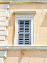 Old Italian (Rome) window. Blue wooden  shutter windows.