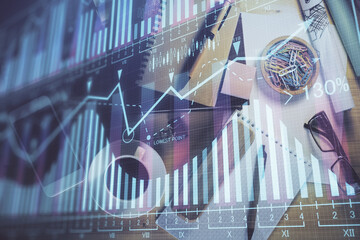 Double exposure of forex graph drawing and work table top veiw. Concept of financial analysis.