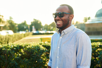 Portrait of an African American businessman. Happy smiling man outdoors