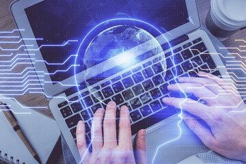 Double exposure of man's hands typing over computer keyboard and brain hologram drawing. Top view. Ai and data technology concept.