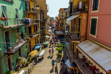Fototapeta na wymiar A view down the main street in the picturesque village of Manarola, Cinque Terre, Italy in the summertime