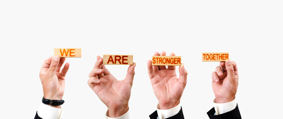 We are stronger together concept. wooden blocks in hand with inscriptions