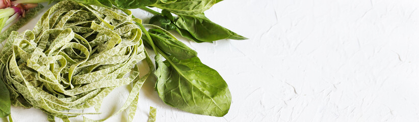 spinach fettuccine pasta , vegetarian cuisine. copy space. banner