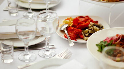 Catering. served table with an emphasis on pickled vegetables cucumbers and peppers 