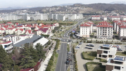 Russia, Sochi, 05 March 2020 residential cottages are located next to a large highway