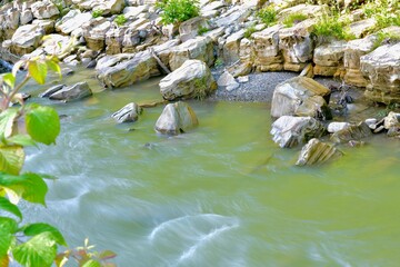 Fototapeta na wymiar river bed with rocky bottom and banks