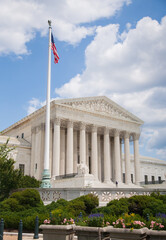 Washington DC -6/27/2009: The supreme court building with flag. The Supreme Court of the United States is the highest federal court of the United States. 
