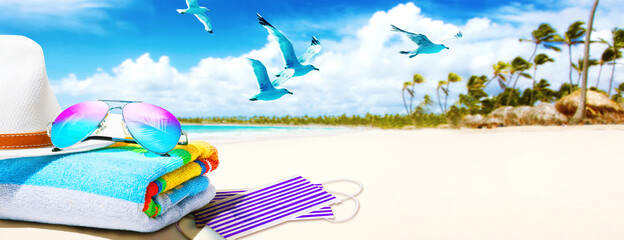 Sunglasses with Coronavirus mask on the beach