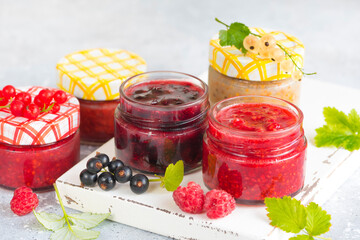 raspberry and currant jam in small jars