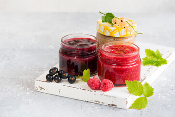 raspberry and currant jam in small jars