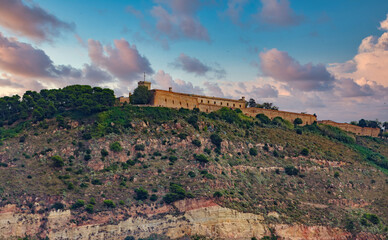 Fototapeta premium Fortress on Barcelona Mountain at Dusk