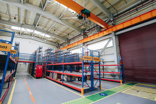 Godown and store room with empty shelves  painted with red and blue color