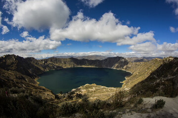 Flooded volcano Quilotoa in south america with mountains arround