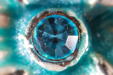 Close up shot of crystal embedded in the metal
