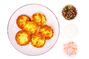 Vegetable marrow pancakes with white sauce. Photo