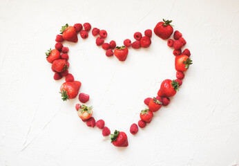 valentines day heart outline made of fresh raspberries and strawberries