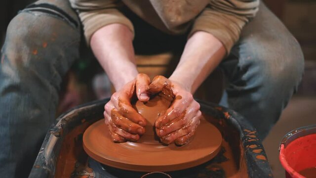 Working process of handmade clay production in pottery workshop. Concept of handmade craft production.