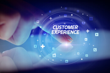 Finger touching tablet with social media icons and CUSTOMER EXPERIENCE