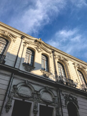 Fototapeta premium Old white palace building in the streets of Santiago downtown with amazing cloudy and blue sky