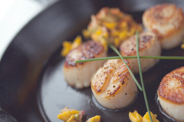 Seared scallops with Mango Salsa in cast iron pan
