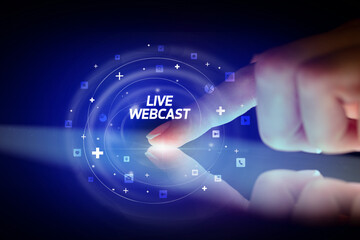 Finger touching tablet with social media icons and LIVE WEBCAST
