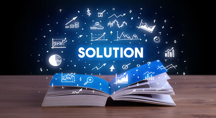 SOLUTION inscription coming out from an open book, business concept