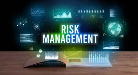 RISK MANAGEMENT inscription coming out from an open book, creative business concept