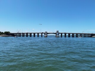 Bridge at the shore, Blue sky with clear water