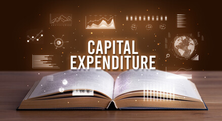 CAPITAL EXPENDITURE inscription coming out from an open book, creative business concept