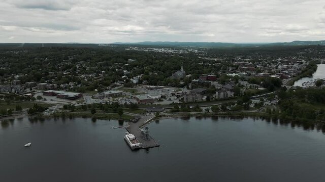 Peaceful Town By The Lake Memphremagog With Wharf And Observatory Tower In MacPherson Dock In Magog, Quebec, Canada. -aerial drone