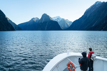 Traveller with beautiful scenic of milford sound in fiordland national park new zealand.