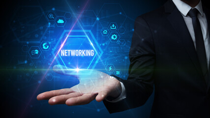 Man hand holding NETWORKING inscription, social media concept