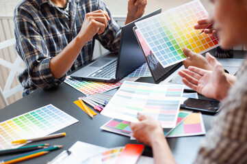 Professional design team brainstorm ideas for colorful designs.