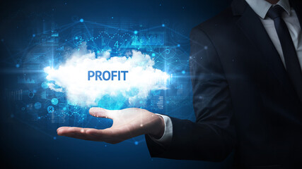 Hand of Businessman holding PROFIT inscription, successful business concept