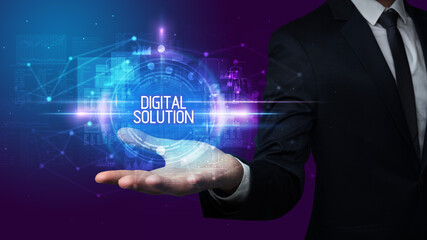 Naklejka premium Man hand holding DIGITAL SOLUTION inscription, technology concept