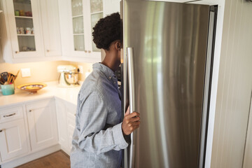 Woman opening the fridge