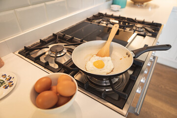 Cooked eggs in a pan in the kitchen