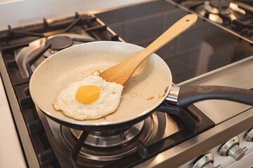 Cooked eggs in a pan in the kitchen