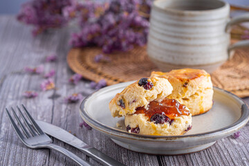 Traditional British scones with a tea cup and blurred background