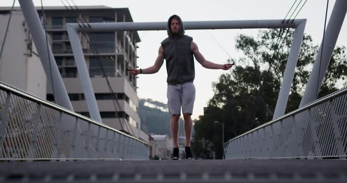 Sporty Caucasian man training on a bridge