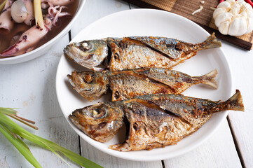 Deep fried mackerel with fish sauce, Traditional Thai food.