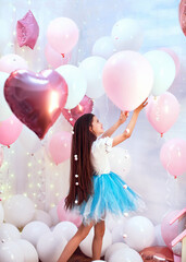 Happy celebration of birthday party with pink helium balloons cute little girl