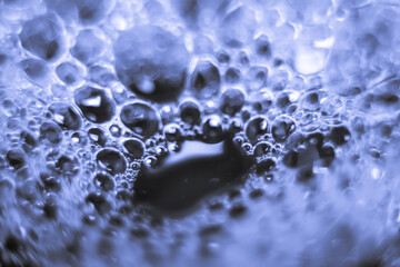 bubbles soap on water surface, shine with a bright, shimmering reflected light.