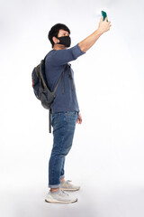 Backpacker Asian man with black mask wear long-sleeved T-shirts, blue jeans, raise the smartphone to find a signal, shoulder backpack isolated on white background, traveling concept