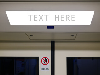 .Blank white digital ads space advertising board for text on subway or sky train, copy space, traveling in the city ..