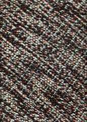 Handwoven wool fabric in black and white with red and orange details