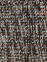 Obraz premium Handwoven wool fabric in black and white with red and orange details
