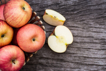 red apples with slice on wooden table. Top view.